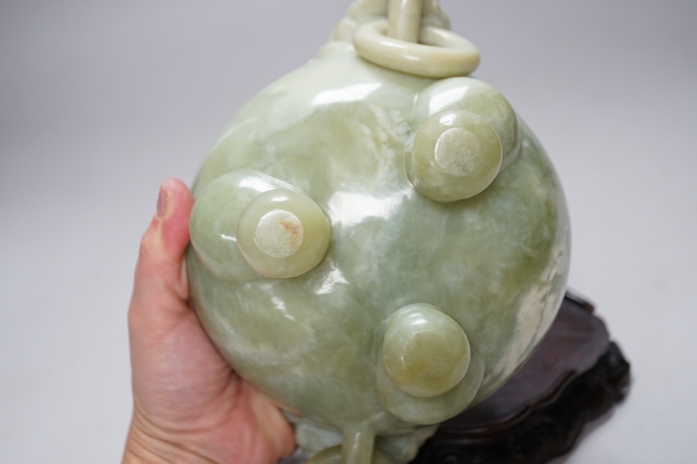 A large Chinese bowenite jade censer and cover on carved hardwood stand, 21cm wide